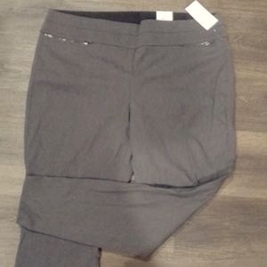Dark grey slacks front zipper pocket detail